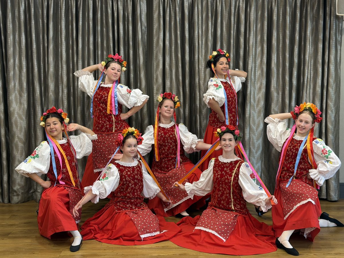 The Intermediate competition group in red folk costumes